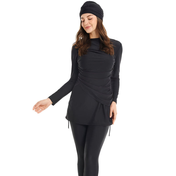 Maillot de bain burkini noir pour femme avec haut à manches longues et legging assorti, idéal pour la natation et les activités aquatiques avec modestie. Style élégant et confortable pour les femmes musulmanes.