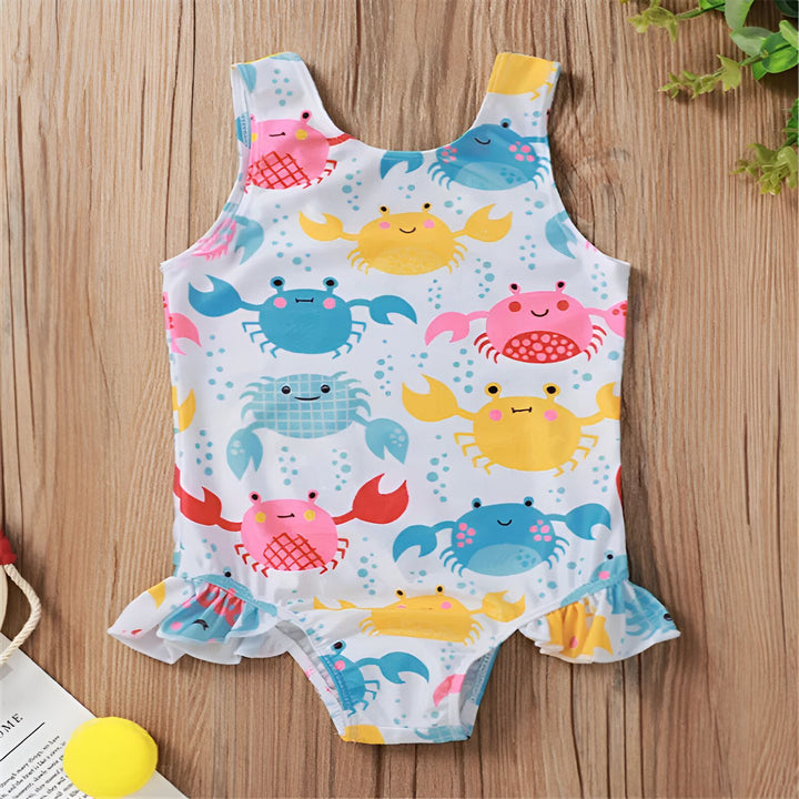 Maillot de bain une pièce rose à motifs de beignets pour enfant, avec bouée de sauvetage décorative. Accessoire de plage mignon et coloré pour les petites filles.