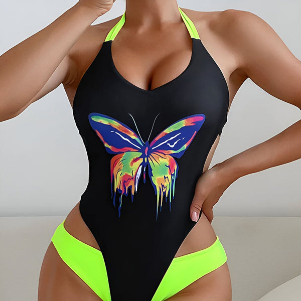 Gros plan d'un bas de maillot de bain noir et vert vif. Le tissu noir contraste avec la bordure vert fluo. Détail de couture visible. Idéal pour la mode estivale et les vêtements de plage.