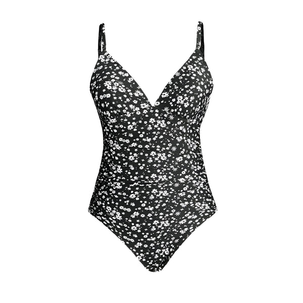 Dos d'un maillot de bain une pièce noir à imprimé floral blanc, avec des bretelles fines. Idéal pour la plage ou la piscine. Mode estivale féminine et élégante.