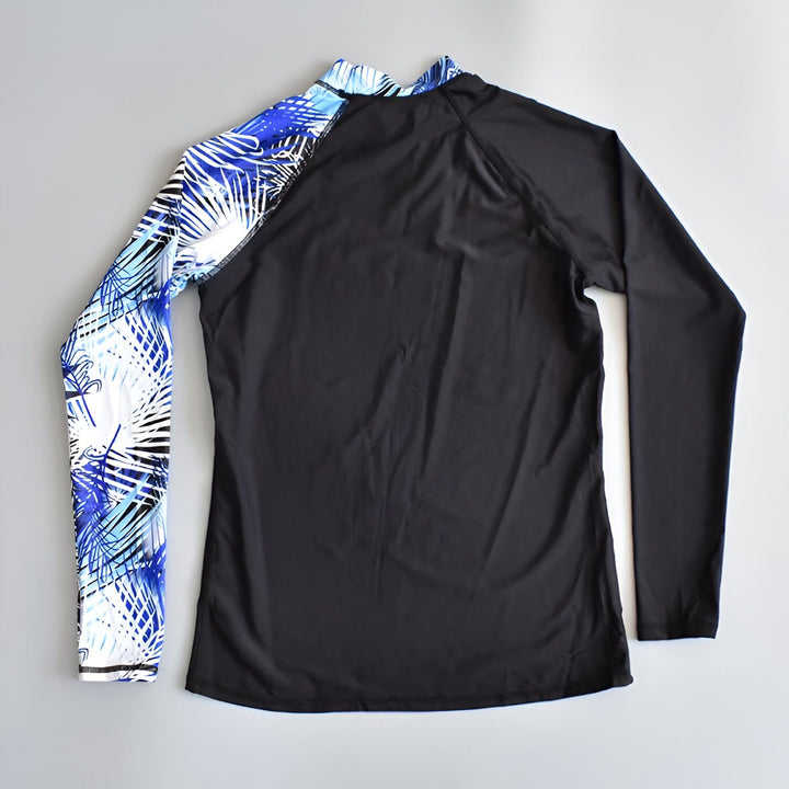 Ensemble de protection solaire noir pour homme avec manches longues à motifs tropicaux bleus et short avec bordure blanche, marque TubeTree. Idéal pour la natation, le surf et les activités aquatiques.