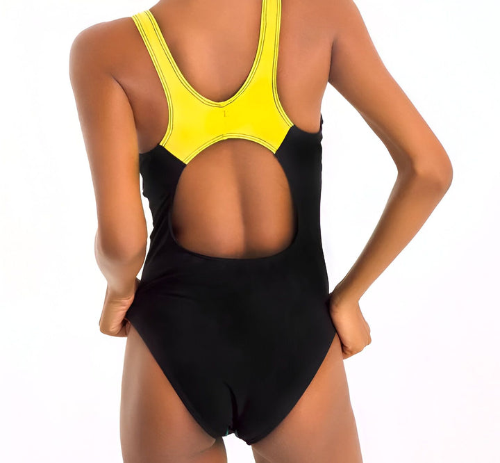 Maillot de bain une pièce bleu et marine pour femme. Design sportif et élégant. Idéal pour la natation et les vacances d'été.