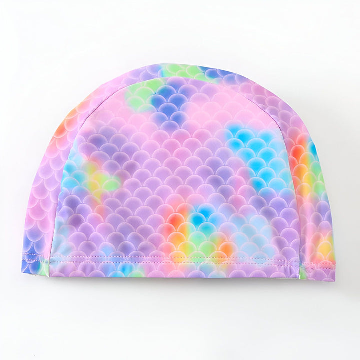 Maillot de bain enfant motif sirène avec flotteurs intégrés et bonnet assorti. Vêtement de bain pour filles, couleurs pastel et design écailles. Sécurité et style pour la plage ou la piscine.