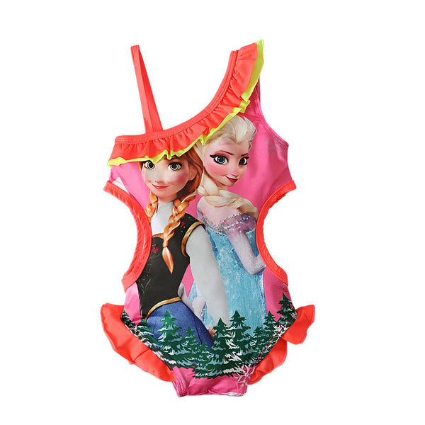 Gros plan sur un motif d'Elsa et Anna de La Reine des Neiges, sur un tissu rose vif, avec des détails colorés sur les bords.