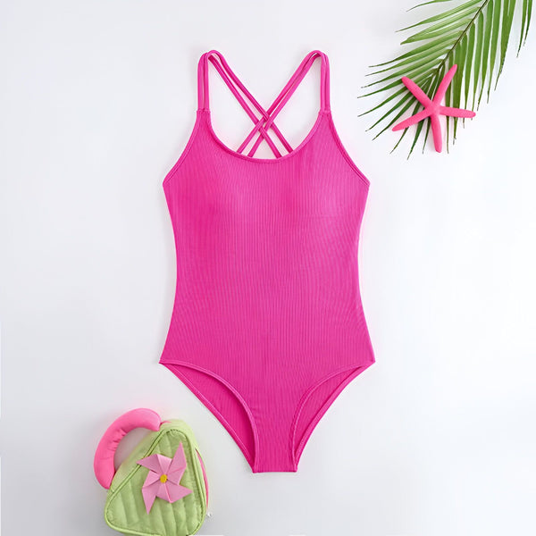 Vue arrière d'un maillot de bain une pièce rose vif avec des bretelles croisées et un intérieur blanc.