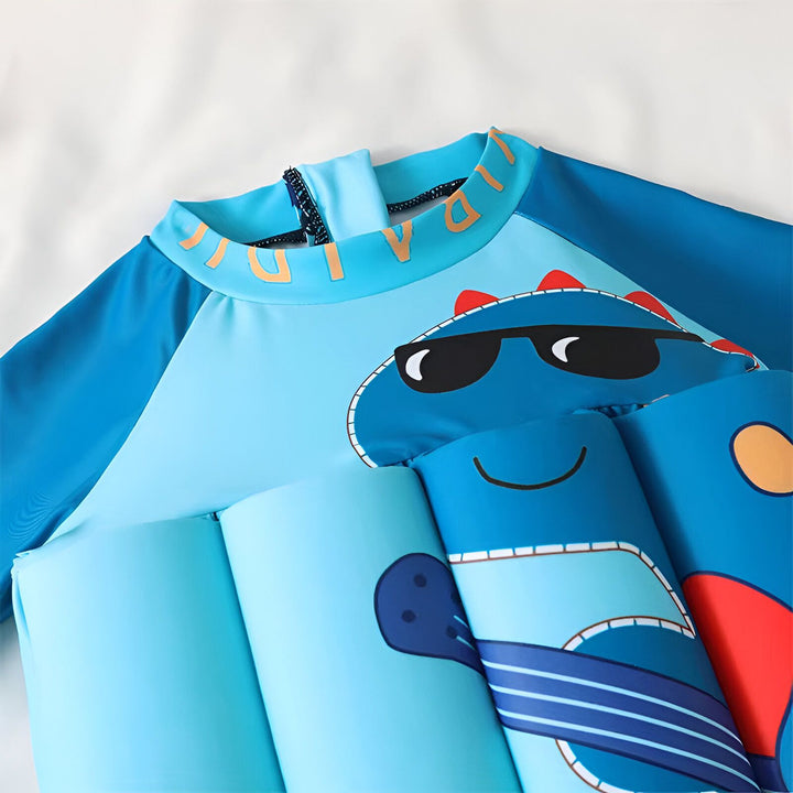 Maillot de bain flottant pour enfant avec motif de dinosaure bleu portant des lunettes de soleil. Vêtement de protection solaire pour la piscine et la plage. Idéal pour apprendre à nager en toute sécurité.