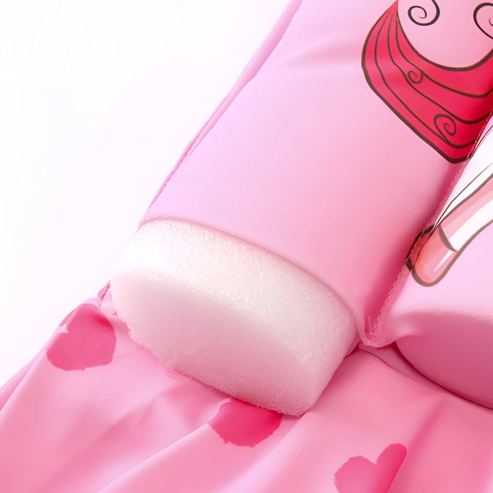 Maillot de bain flottant rose pour enfant, avec des motifs de cœurs et de licornes, idéal pour la piscine ou la plage.