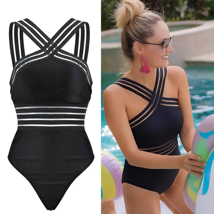 Maillot de bain une pièce noir avec bretelles croisées et détails argentés. Élégant et confortable pour la plage ou la piscine.