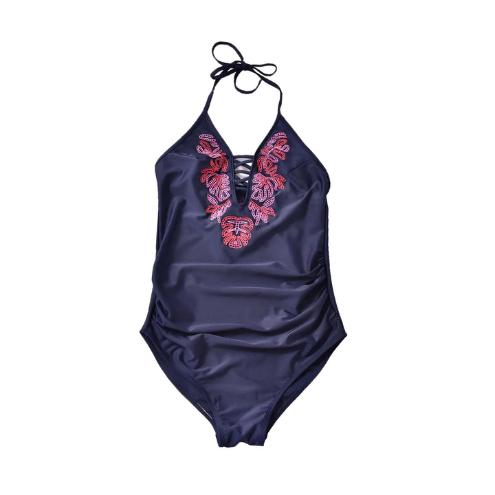 Maillot de bain une pièce bleu marine avec broderies florales roses et rouges sur le devant. Bretelles à nouer autour du cou. Idéal pour la plage ou la piscine.