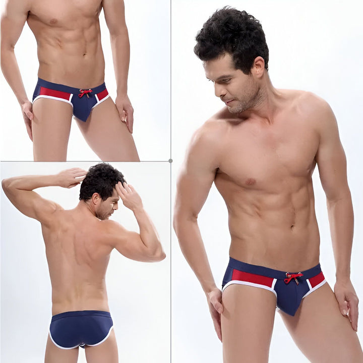 Vue arrière d'un homme portant un slip de bain jaune vif avec des bordures blanches. Le dos et les mains de l'homme sont visibles.