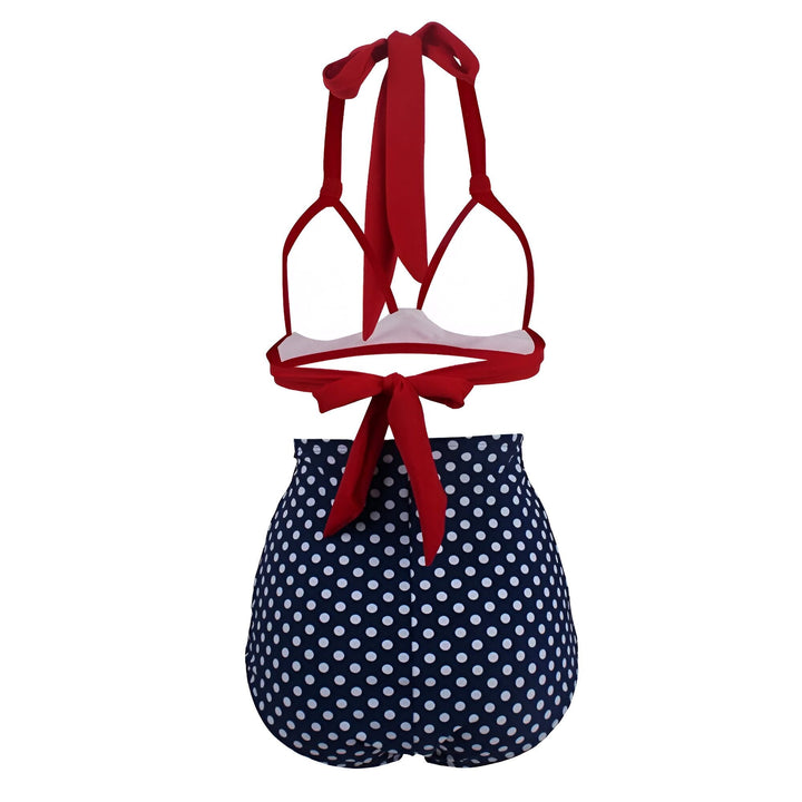 Culotte de bain taille haute à pois bleu marine et blancs. Tissu opaque au centre. Vêtement de plage pour femme, style rétro. Accessoire de mode féminine.