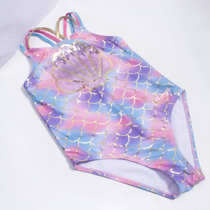 Maillot de bain enfant motif sirène, écailles colorées et coquillage à paillettes. Bretelles croisées multicolores. Vêtement de plage fille original.
