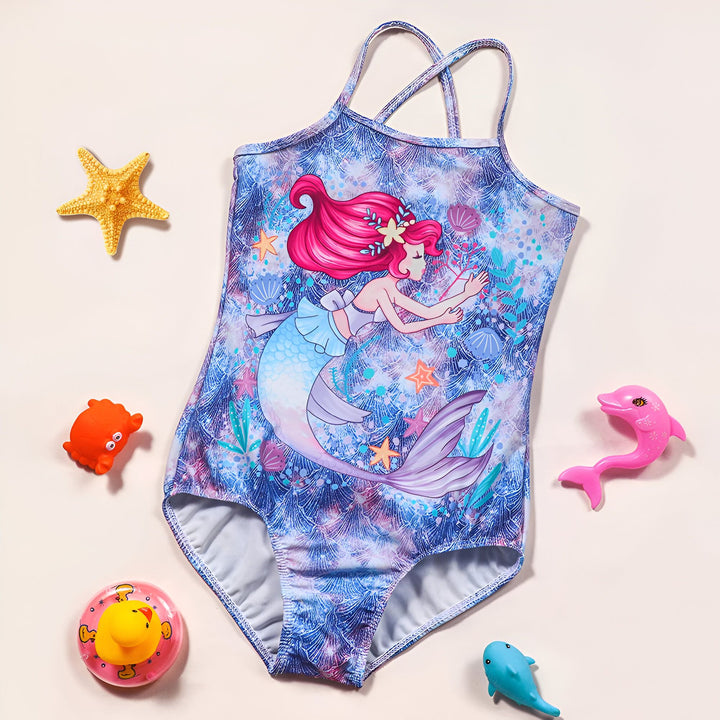 Gros plan d'un bas de maillot de bain pour enfant avec un motif floral et marin bleu, rose et violet. La doublure intérieure est blanche.