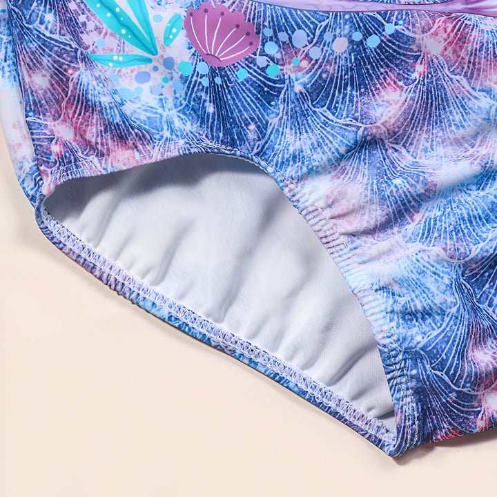 Maillot de bain une pièce pour fille avec motif sirène et jouets de plage. Idéal pour la natation et les activités aquatiques. Couleurs vives et design amusant. Parfait pour l'été !