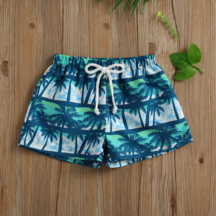 Short de bain pour enfant avec motif de palmiers, idéal pour la plage ou la piscine. Vêtement d'été confortable et tendance.
