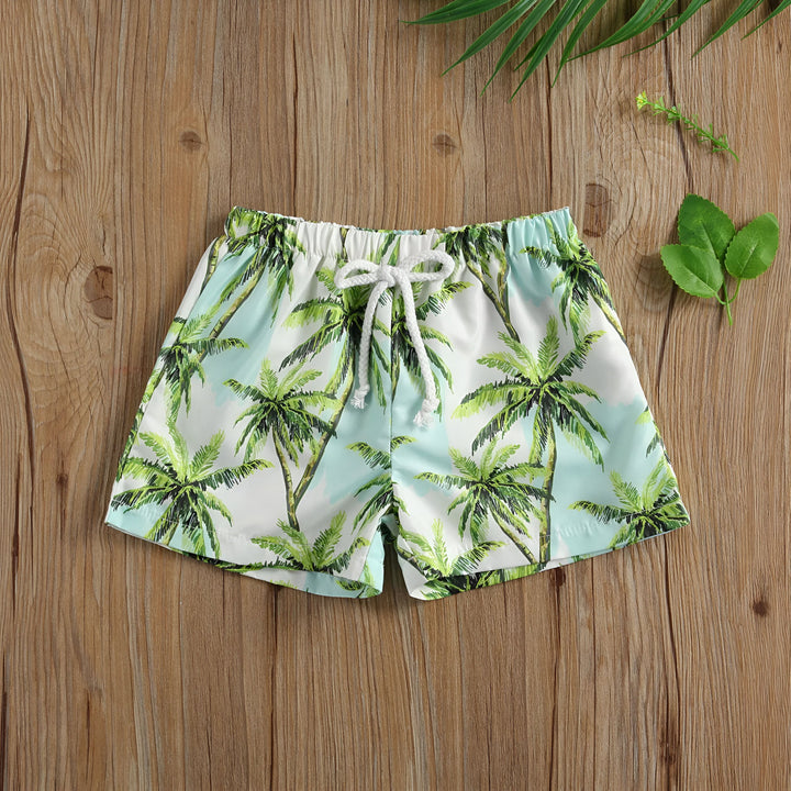Short de bain pour enfant avec motif camouflage, cordon blanc à la taille élastique. Vêtement d'été décontracté, idéal pour la plage ou la piscine. Style militaire tendance, confortable et pratique.
