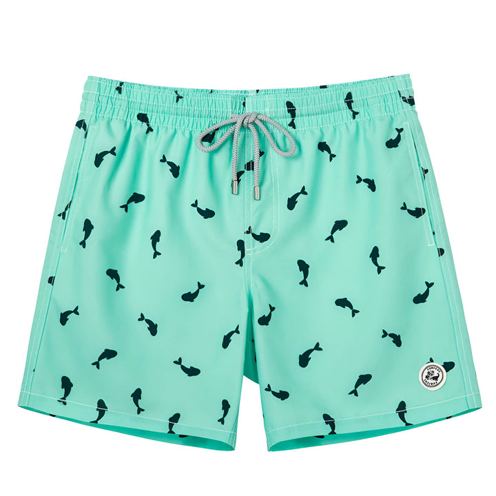 Short de bain turquoise pour homme, motif de poissons noirs, poche latérale, taille élastique avec cordon de serrage. Marque Surf Cuz. Idéal pour la plage et la piscine.